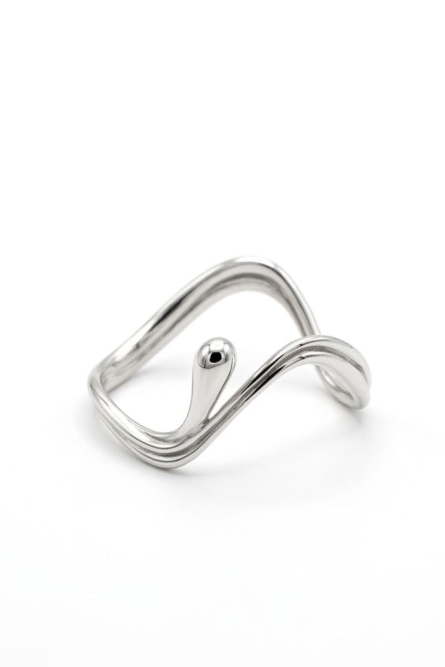 A polished silver open ring with a wavy, fluid design and a small protruding bead detail, shown on a clean white background.